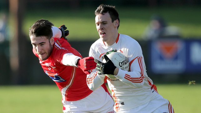 Louth debutant Patrick Reilly tussles for possession against Armagh yesterday